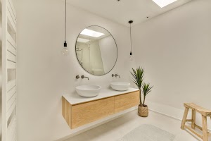 a-white-bathroom-with-two-sinks-and-a-mirror-2025-02-10-13-21-27-utc.jpg