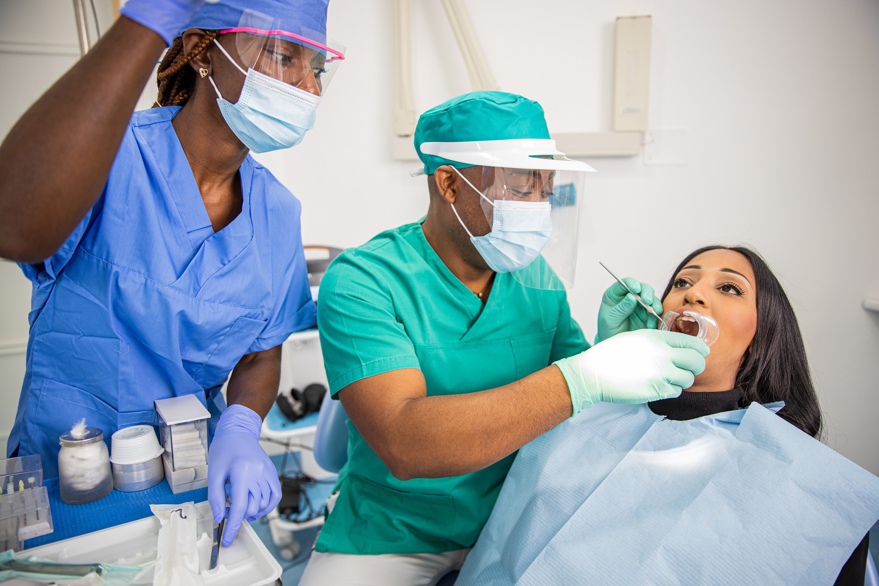 a-dentist-checks-a-patient-s-teeth-in-an-african-d-2025-03-09-11-49-38-utc.jpg