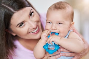 mother-and-her-newborn-baby-with-teething-ring-2025-01-08-19-06-42-utc.jpg