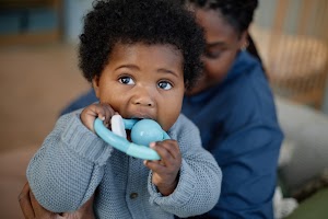 portrait-of-cute-little-baby-girl-biting-teether-w-2025-04-11-01-19-08-utc.jpg