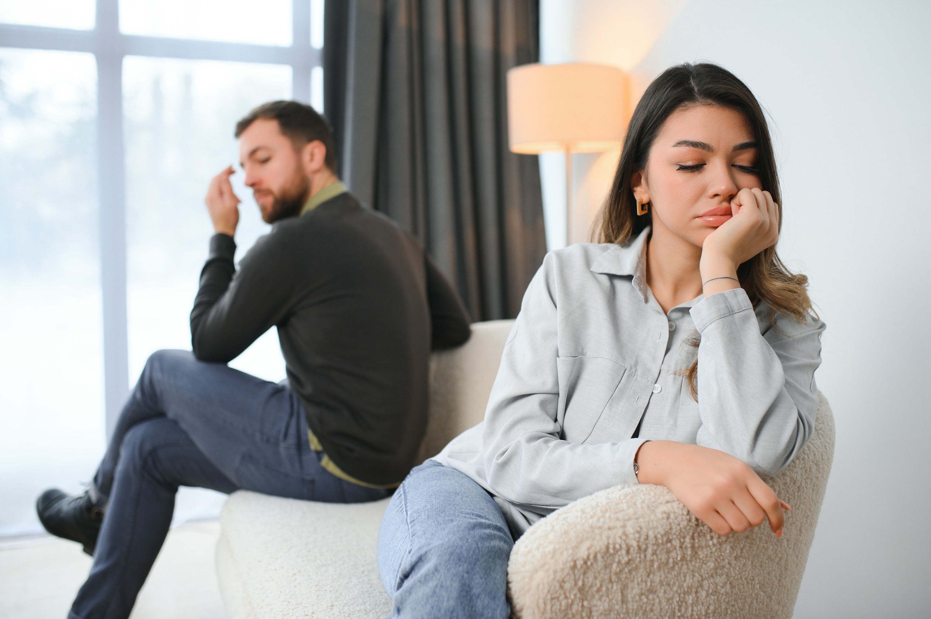 beautiful-couple-is-sitting-back-to-back-on-the-co-2025-03-18-13-06-33-utc.jpg