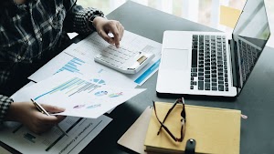 close-up-businessman-and-partner-using-calculator-2025-01-10-06-14-43-utc.jpg