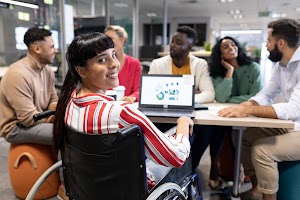 smiling-biracial-disabled-businesswoman-looking-ov-2025-04-03-21-31-09-utc.jpg