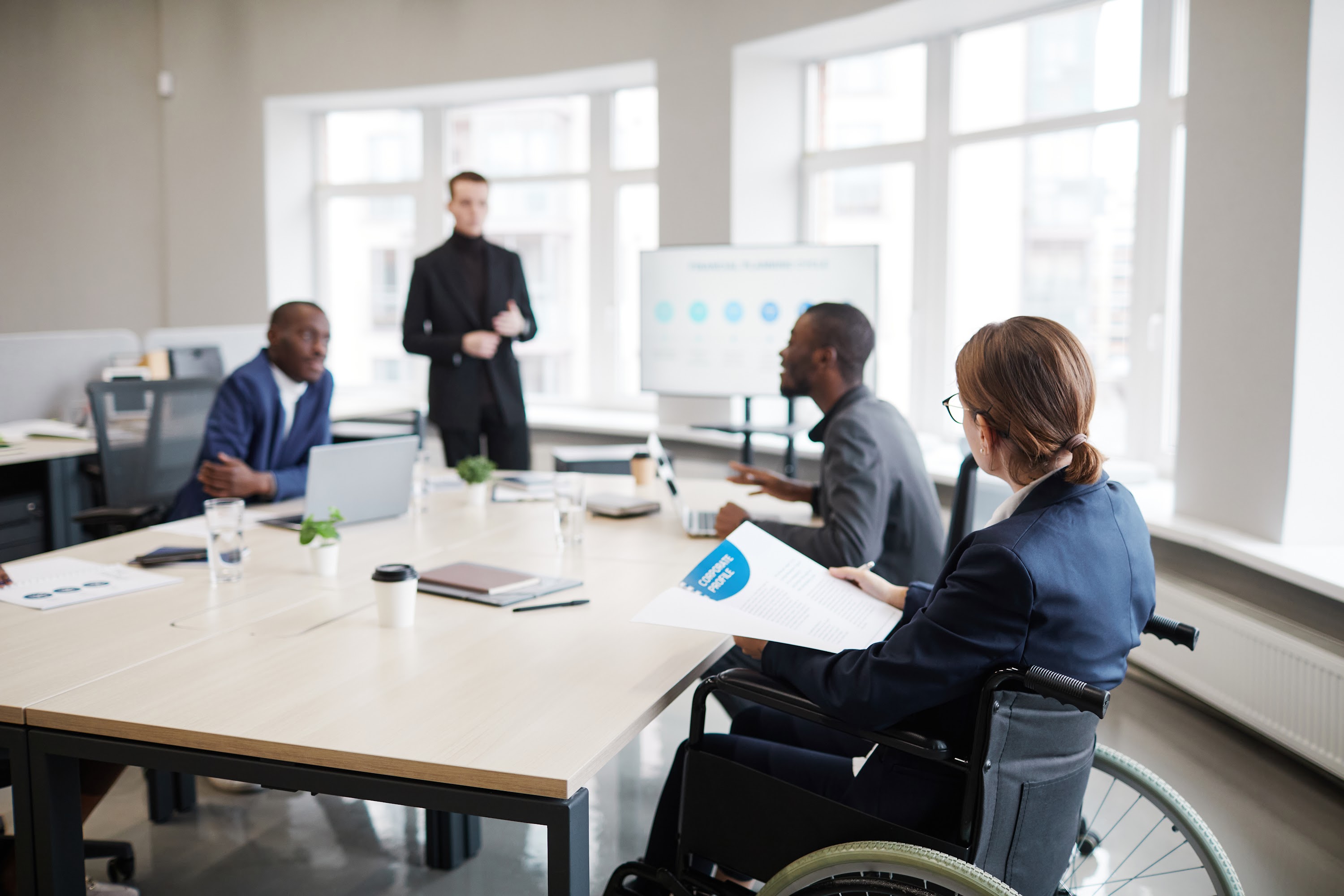 woman-using-wheelchair-in-business-meeting-2025-03-09-04-35-29-utc.jpg