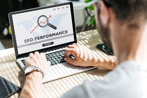 back-view-of-developer-using-laptop-with-seo-perfo-2024-11-18-17-01-05-utc.jpg