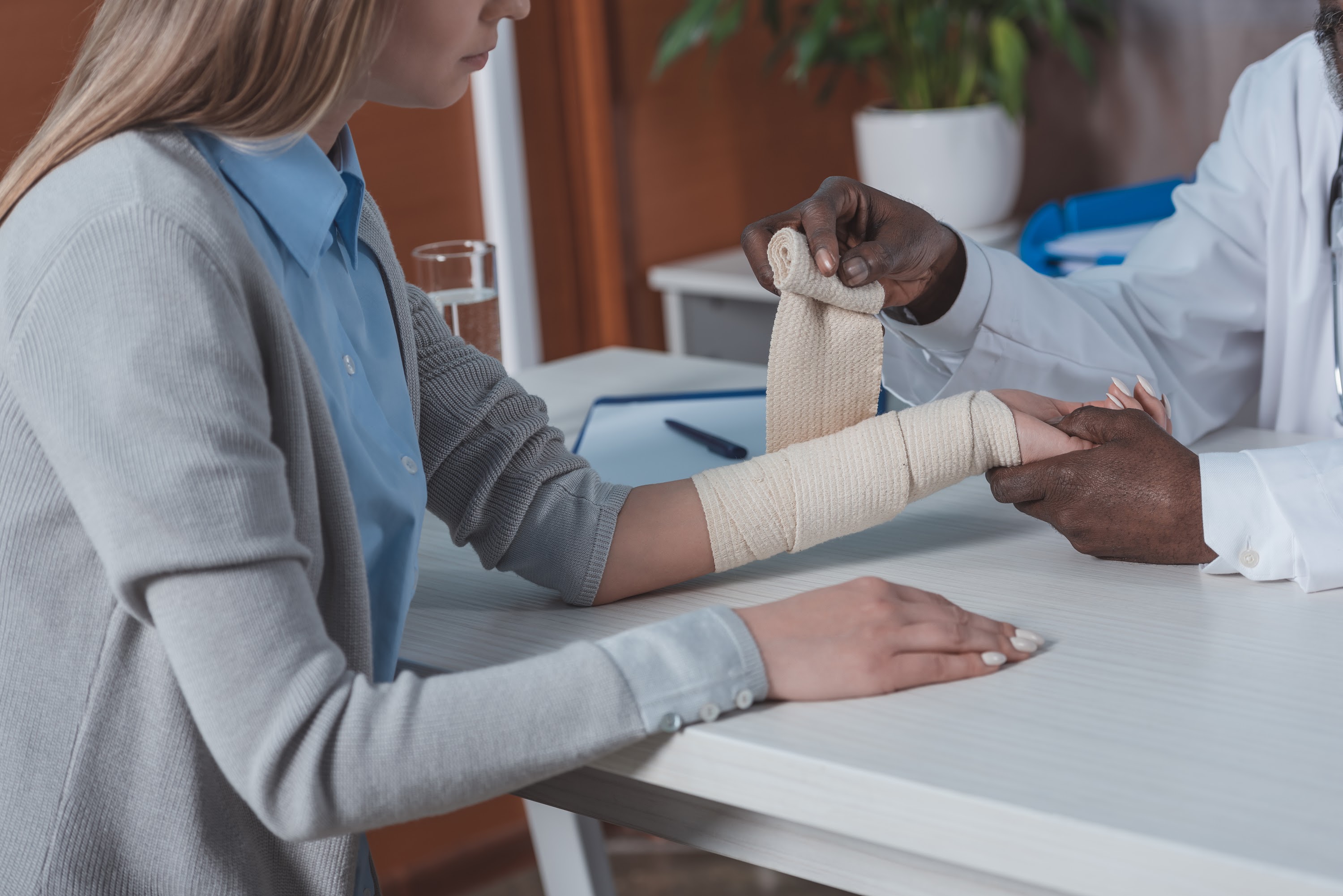 cropped-image-of-african-american-doctor-bandaging-2024-11-15-02-27-11-utc.jpg