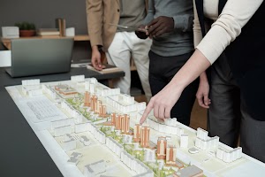 hand-of-female-architect-pointing-at-layout-during-2025-03-16-21-04-14-utc.jpg