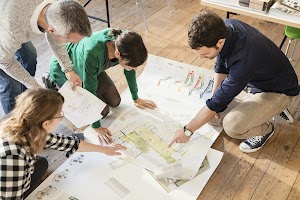 high-angle-view-of-architects-discussing-blueprint-2025-04-04-08-13-02-utc.jpg