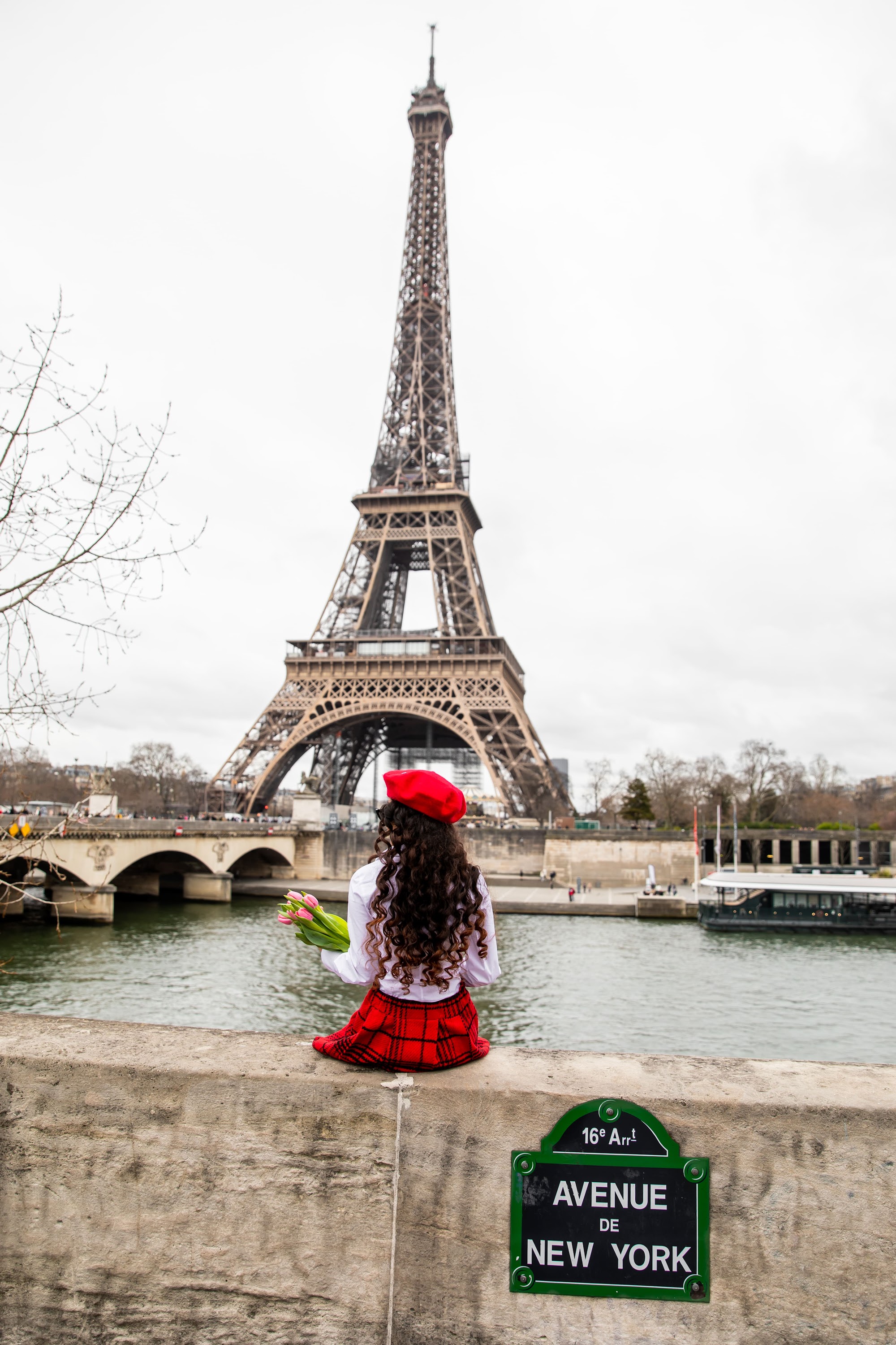 vertical-shot-of-a-parisian-woman-holding-tulips-s-2025-02-09-21-15-46-utc.jpg