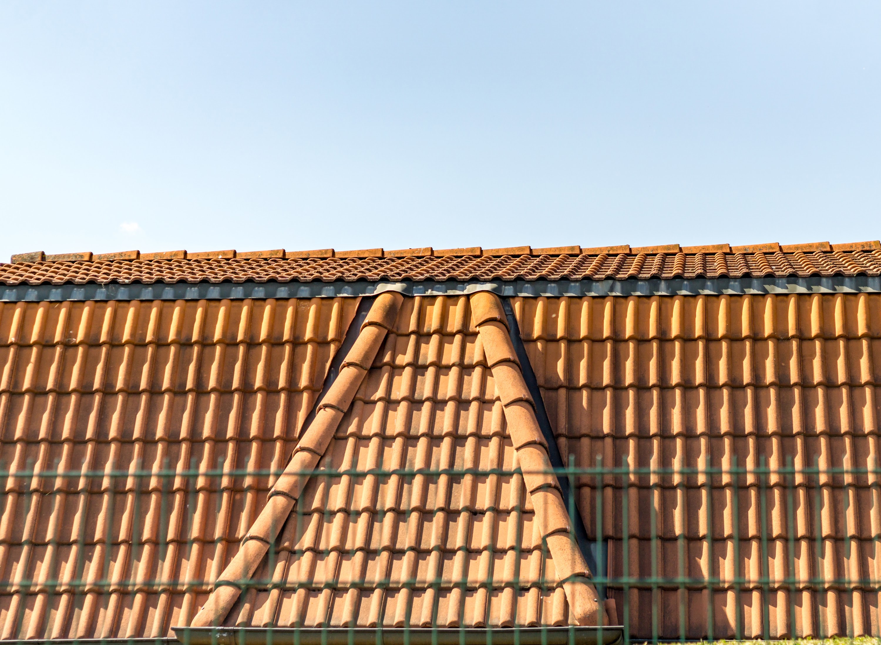roofline-with-shingles-against-blue-sky-with-copy-2025-01-08-15-16-02-utc.jpg