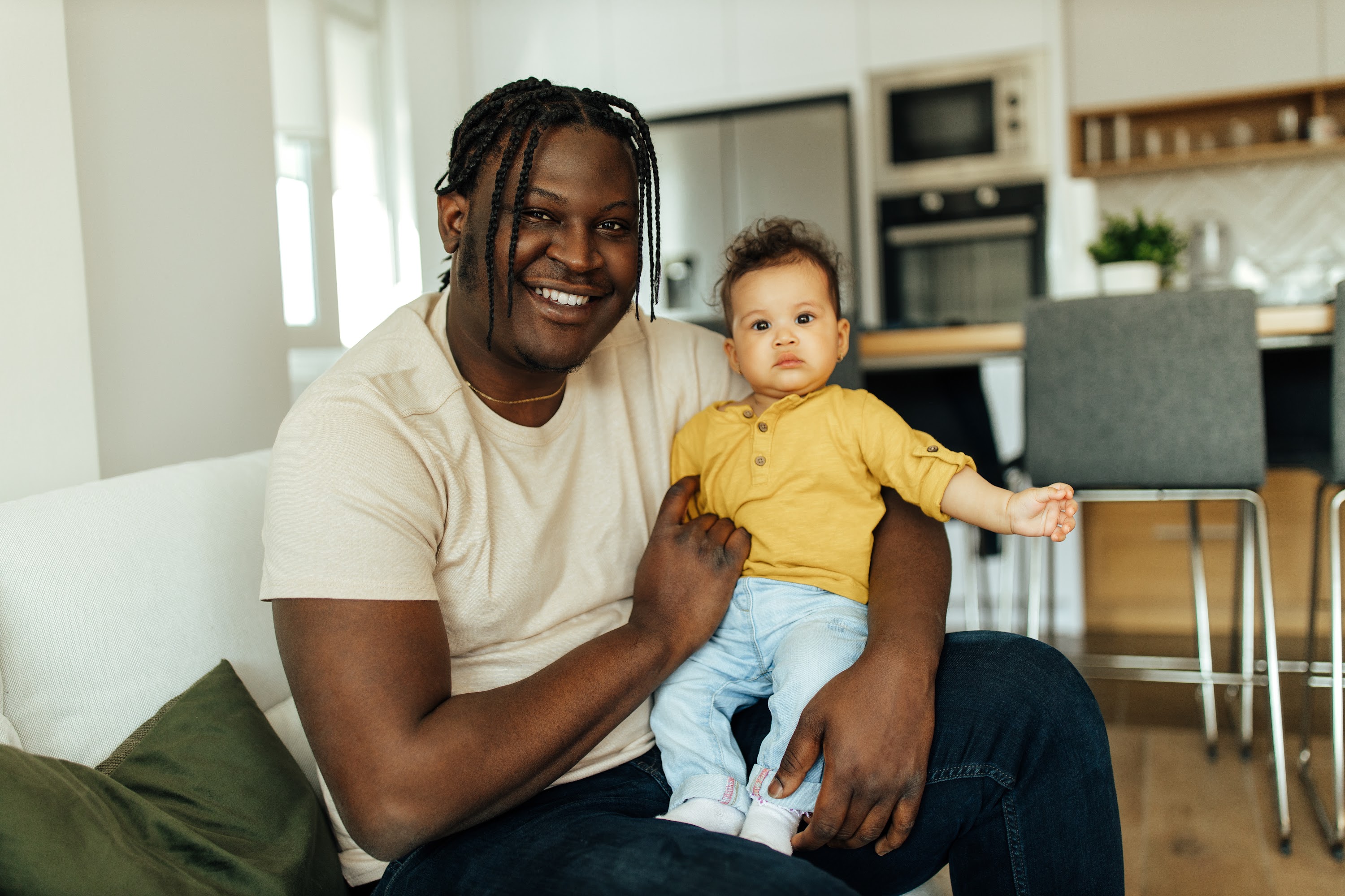 cute-baby-sitting-on-the-lap-enjoying-with-black-2024-10-18-04-34-07-utc.jpg