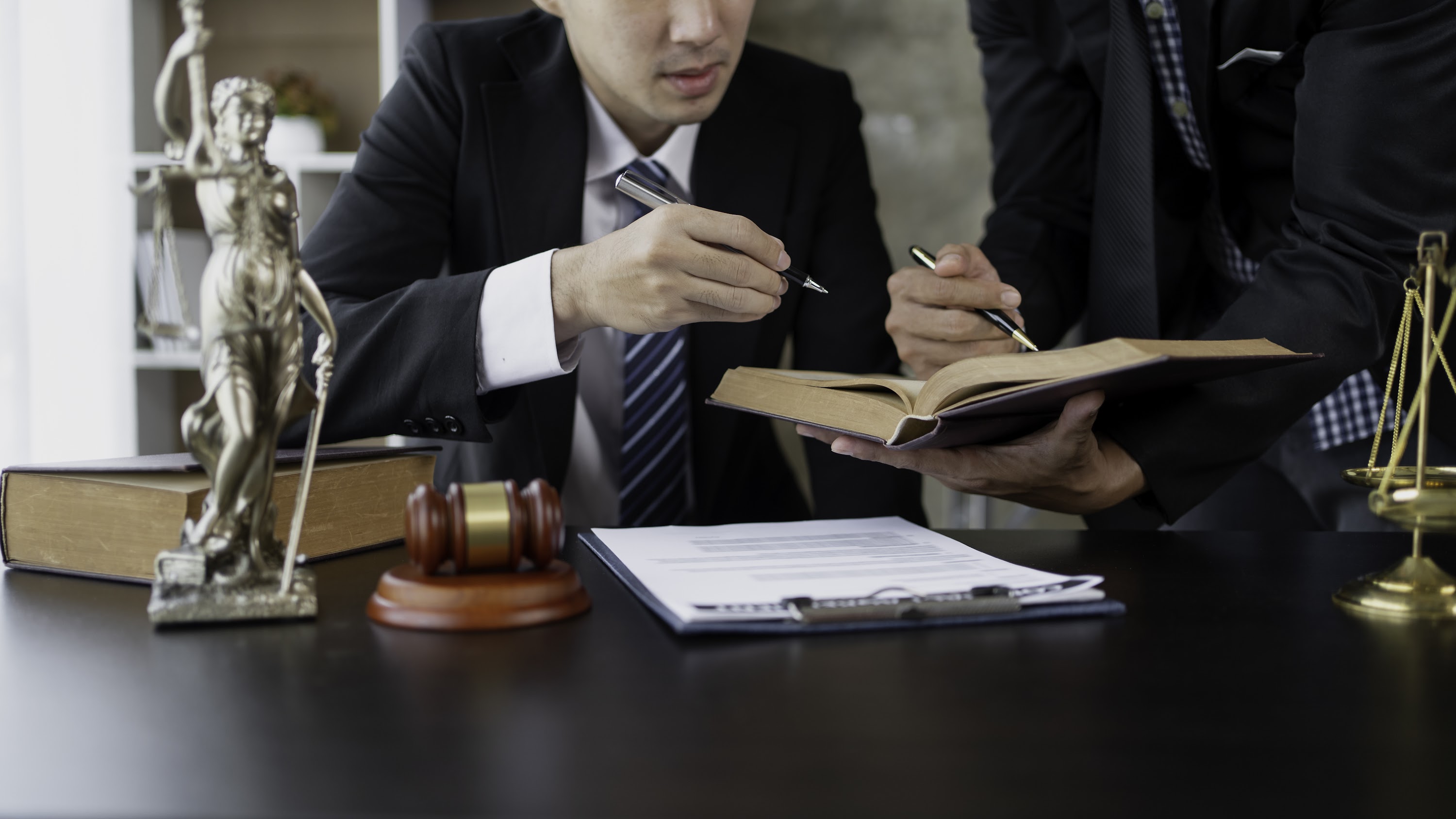 businessman-and-lawyer-discuss-the-contract-docume-2025-03-08-16-22-15-utc.jpg