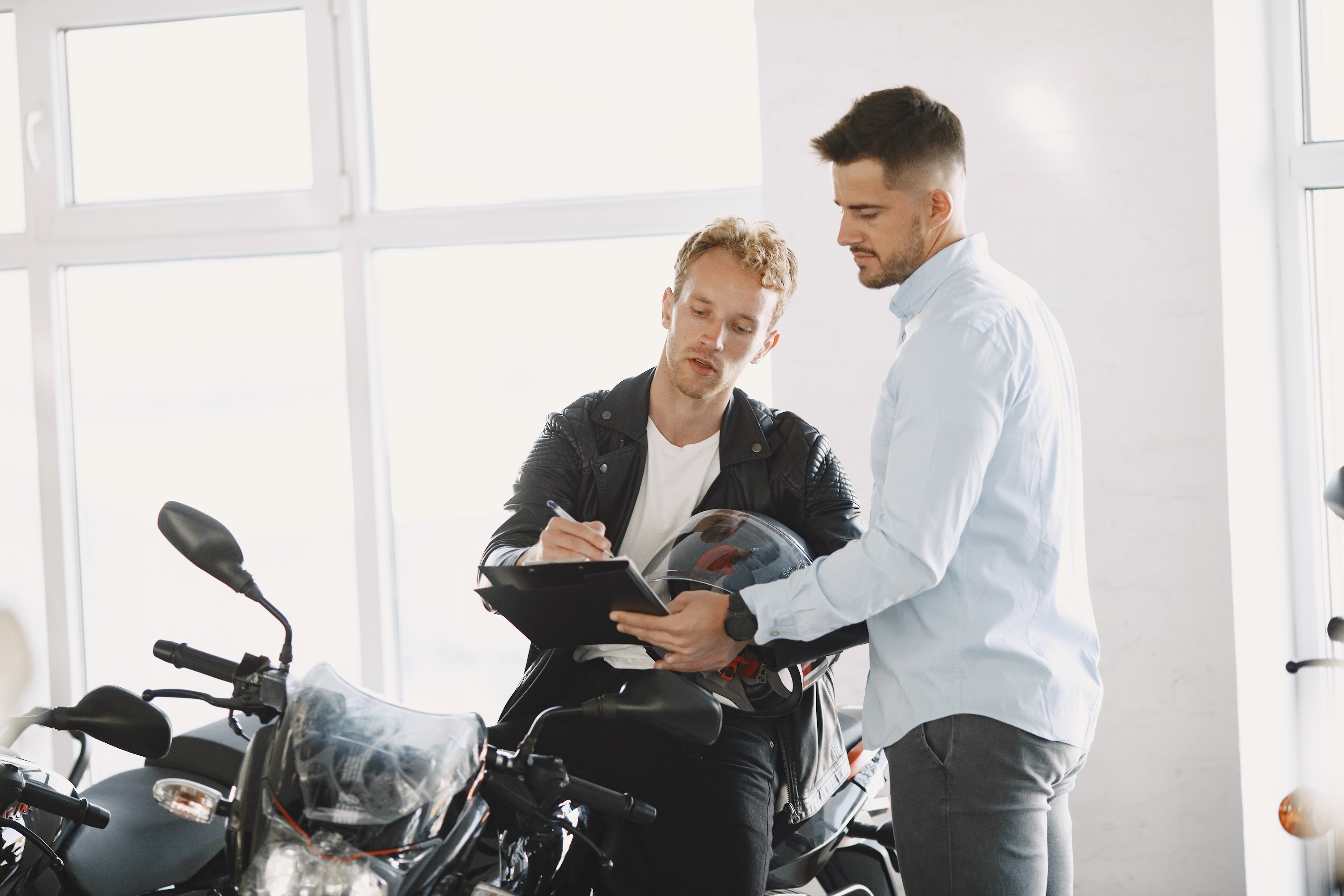 handsome-man-choosing-a-motorcycle-to-buy-2024-12-06-13-02-11-utc.jpg