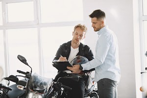 handsome-man-choosing-a-motorcycle-to-buy-2024-12-06-13-02-11-utc.jpg