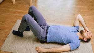 man-with-a-headache-laying-on-the-floor-2025-02-20-04-45-23-utc.jpg