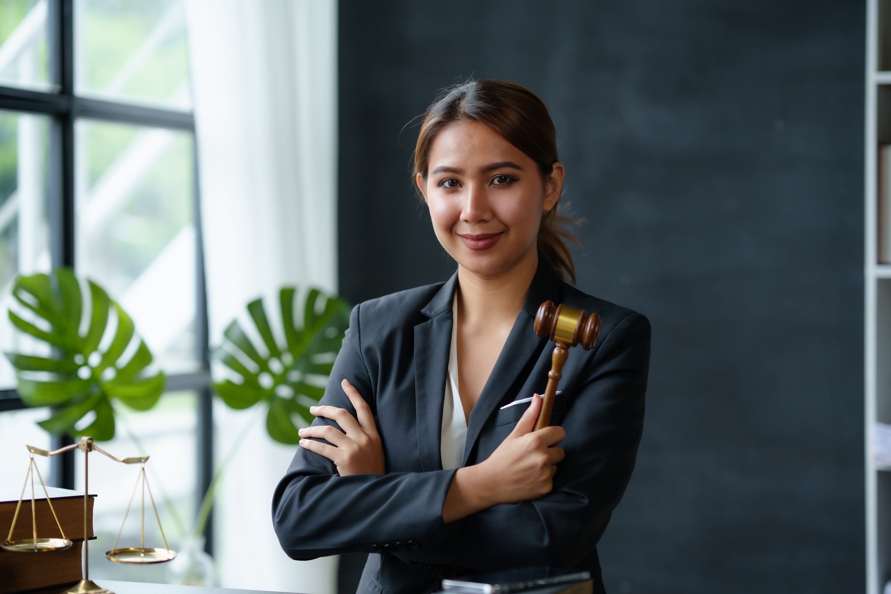 beautiful-asian-woman-lawyer-sitting-at-a-table-sm-2025-03-05-10-38-52-utc.jpg