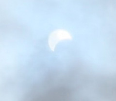 Partial Solar Eclipse obscured/filtered by clouds
