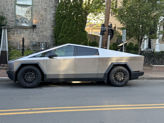 Left side of Tesla cybertruck parked at curb in New Hope, PA, USA