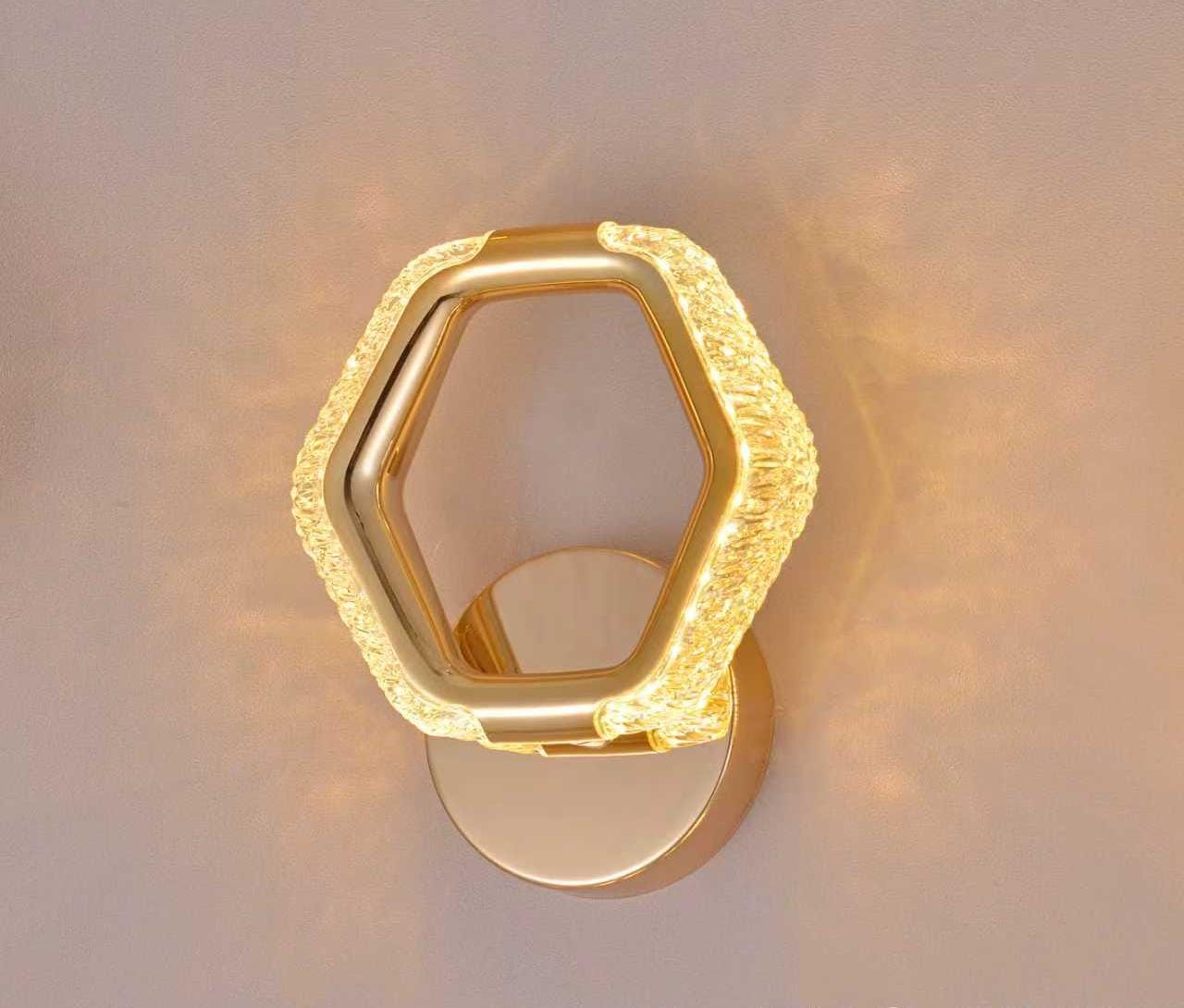 Decorative Gold LED Wall Sconce with Star Effect Glow.